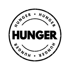 Hunger - a feeling of discomfort or weakness caused by lack of food, coupled with the desire to eat, text stamp concept background