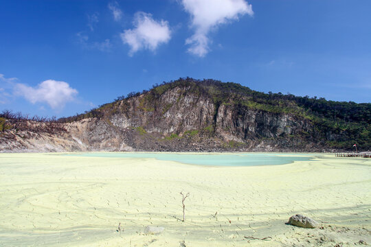 White Crater or Kawah Putih, a volcanic sulphur crater lake in a caldera in Ciwidey, West Java, Indonesia with mud cracks in the sulphur.