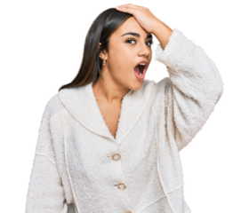 Young brunette woman wearing casual clothes surprised with hand on head for mistake, remember error. forgot, bad memory concept.