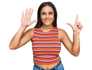 Young brunette woman wearing casual clothes showing and pointing up with fingers number seven while smiling confident and happy.