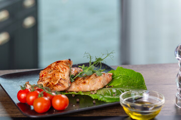 Fried chicken breast with herbs and tomatoes