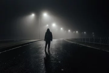Fotobehang Sad man alone walking along the alley in night foggy road © Mulderphoto