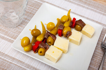 Gilda de queso y anchoas, spanish tapas Gilda pinchos with olives, cheese and anchovies