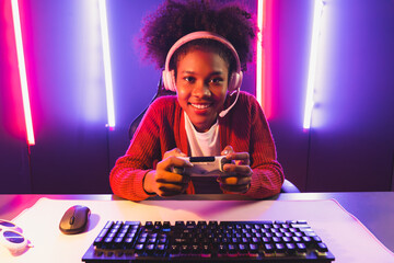 Host channel of gaming streamer, African girl playing online game with joystick, talking with...