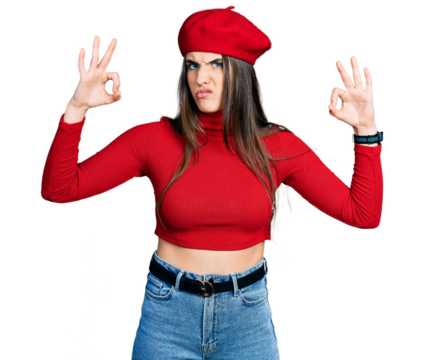 Young brunette teenager doing excellent gesture with hand clueless and confused expression. doubt concept.