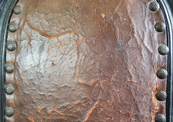 Close up of a surface texture of old crumpled leather.