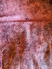 Close up of a surface texture of old crumpled leather.