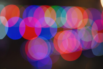 Abstract bokeh night in city background. New Year blurry walpaper. huge garland on the eve of the new year. blur of Christmas wallpaper decorations concept.holiday festival backdrop