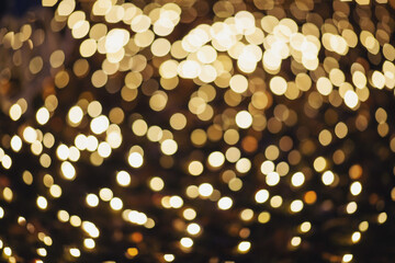 Abstract bokeh night in city background. New Year blurry walpaper. huge garland on the eve of the new year. blur of Christmas wallpaper decorations concept.holiday festival backdrop