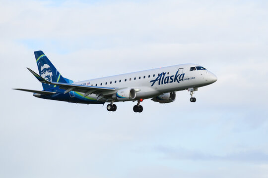 Everett, WA, USA - November 13, 2023; Embraer ERJ-175 jet operated by Alaka Airlines Horizon on final approach