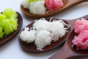 Sweet coconut balls, crispy coconut candies (Maprao Gaew). Thai traditional dessert