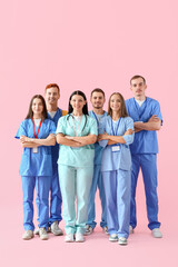 Fototapeta premium Group of medical students on pink background