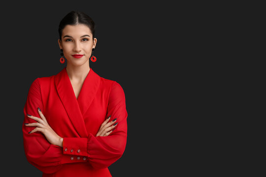 Beautiful young woman on black background. Chinese New Year celebration