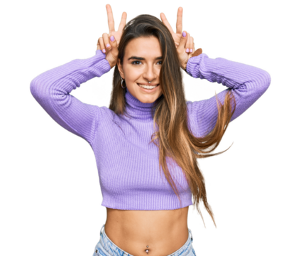 Young hispanic woman wearing casual clothes posing funny and crazy with fingers on head as bunny ears, smiling cheerful