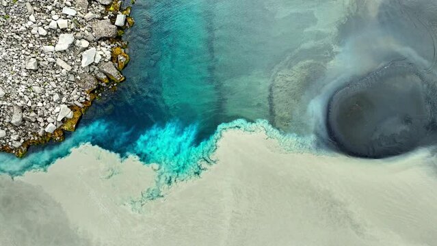 Two Rivers Mix Together Pure Glacial Turquoise Water Mixes With Muddy Water Abstract Patterns
