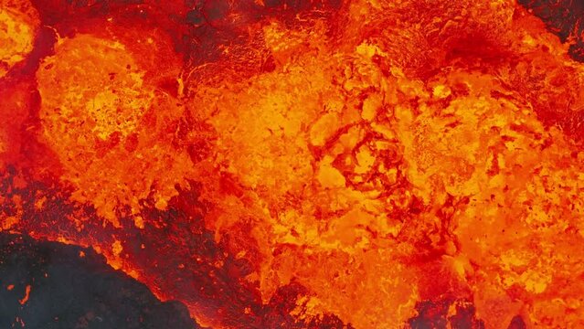 Close up view of active volcanic crater eruption. Hot lava and magma splashing out of crater. Tourist attraction in Iceland Litli-Hr&uacute;tur eruption 2023. Beautiful and dangerous disaster.