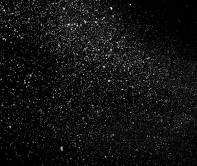 Freezing falling snowflakes or stardust in air on black background for overlay blending mode....