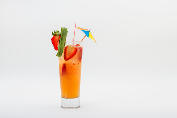 Cocktail drink with strawberries, straw and umbrella isolated on white background.