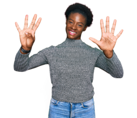 Young african american girl wearing casual clothes showing and pointing up with fingers number nine while smiling confident and happy.