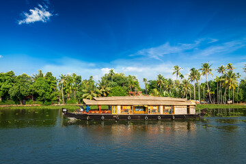 Kerala India travel background - Houseboat on Kerala backwaters. Kerala, India