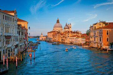 Panorama of Venice Grand Canal with boats and Santa Maria della Salute church on sunset from Ponte dell'Accademia bridge. Venice, Italy - obrazy, fototapety, plakaty