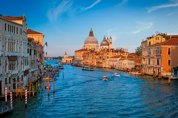 Zelfklevend Fotobehang Panorama of Venice Grand Canal with boats and Santa Maria della Salute church on sunset from Ponte dell'Accademia bridge. Venice, Italy © Dmitry Rukhlenko