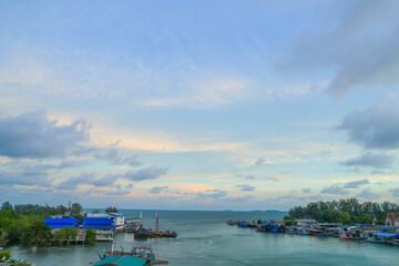 Fototapeta na wymiar the panorama view landscape of Sea Gulf with a pier of boats. The village of sailors and fishing boats in Thailand.
