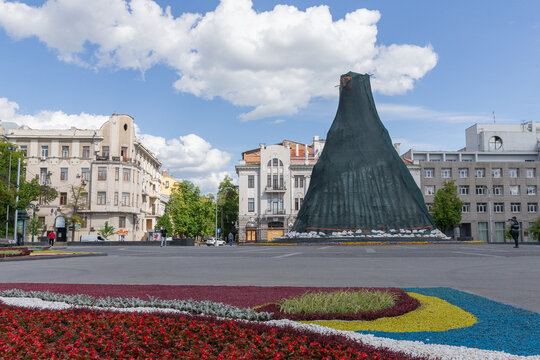 tall historical statue covered for protection in square of shevchenko park in kharkiv city