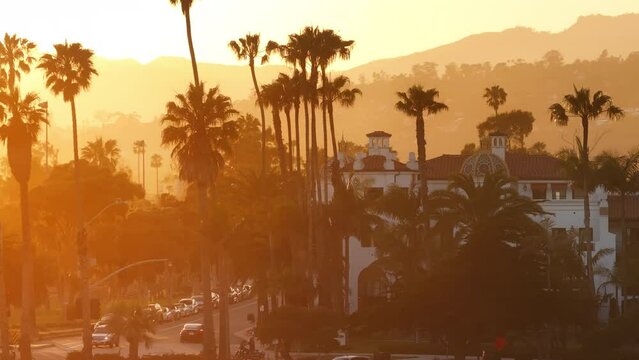 Aerial view of picturesque Santa Barbara skyline at the sunset, California, USA. Palm trees growing on the streets of the resort city. Mountains looking out behind the residential houses, 4k footage 