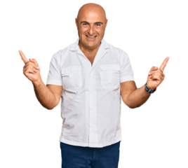 Mature middle east man with mustache wearing casual white shirt smiling confident pointing with fingers to different directions. copy space for advertisement