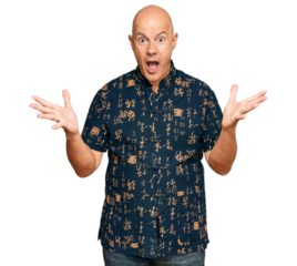 Middle age bald man wearing casual clothes celebrating victory with happy smile and winner expression with raised hands