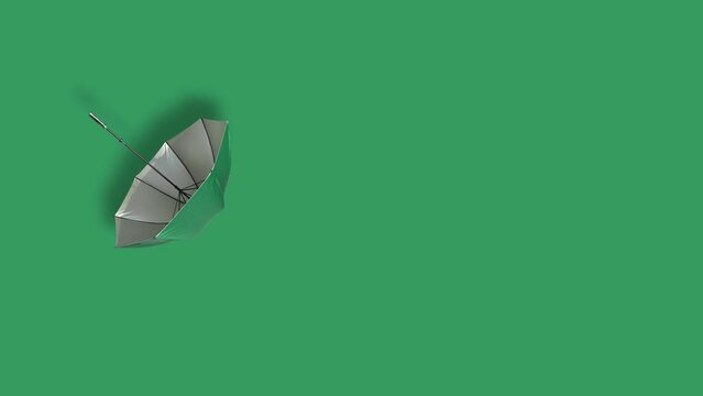 open umbrella with straight handle over green background. floating umbrella with green cloth