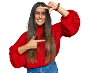 Beautiful hispanic woman wearing casual clothes smiling making frame with hands and fingers with happy face. creativity and photography concept.