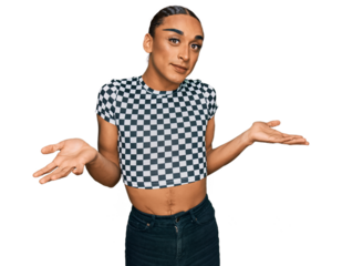 Hispanic transgender man wearing make up and long hair wearing modern clothes clueless and confused expression with arms and hands raised. doubt concept.