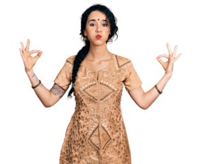 Young indian woman doing gyan mudra puffing cheeks with funny face. mouth inflated with air, catching air.