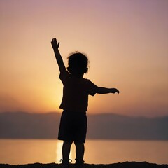 Fototapeta premium Silhouette shot of a child standing against a bright background, with their hand raised