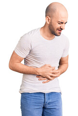 Fototapeta premium Young handsome man wearing casual t shirt with hand on stomach because nausea, painful disease feeling unwell. ache concept.