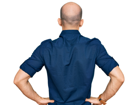 Young hispanic man wearing casual clothes standing backwards looking away with arms on body