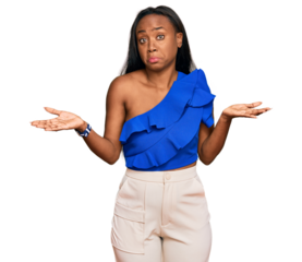 Young black woman wearing casual clothes clueless and confused expression with arms and hands raised. doubt concept.