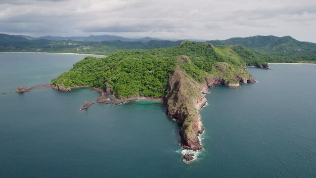 A 4K drone shot of Punta Sabana Point and the Mirador Conchal Peninsula next to Puerto Viejo and Playa Conchal, or &ldquo;Shell Beach&rdquo;, along the north-western coast of Costa Rica.