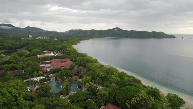 A 4K drone shot of Playa Conchal, or &ldquo;Shell Beach&rdquo;, and Puerto Viejo, next to the Mirador Conchal Peninsula, along the north-western coast of Costa Rica.