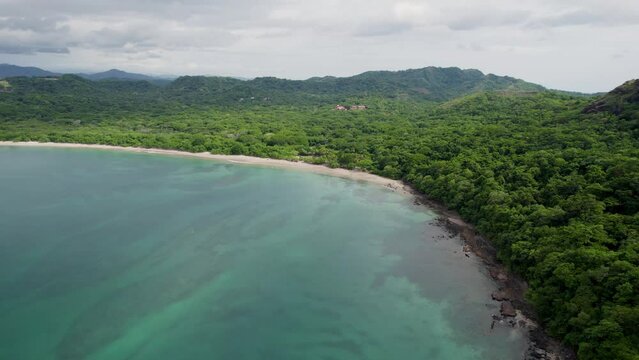 A 4K drone shot of Playa Conchal, or &ldquo;Shell Beach&rdquo;, and Puerto Viejo, next to the Mirador Conchal Peninsula, along the north-western coast of Costa Rica.