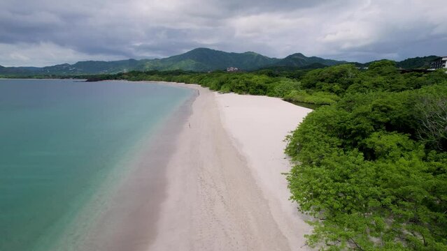 A low-flying 4K drone shot of Playa Conchal, or &ldquo;Shell Beach&rdquo;, and Puerto Viejo, next to the Mirador Conchal Peninsula, along the north-western coast of Costa Rica.