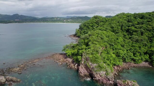 A 4K drone shot of Punta Sabana Point and the Mirador Conchal Peninsula next to Puerto Viejo and Playa Conchal, or &ldquo;Shell Beach&rdquo;, along the north-western coast of Costa Rica.