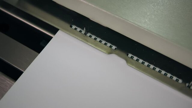 bookbinding machine slow motion shot