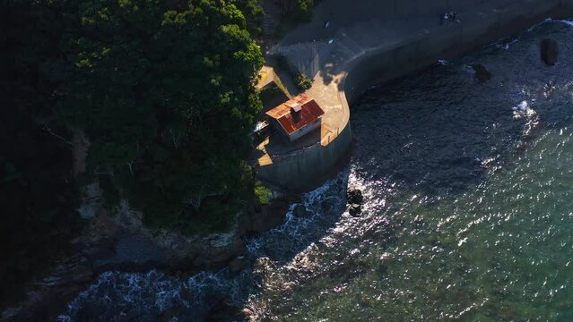 Ama Diver Hut in Osatsu Japan, Aerial Tilt Establishing Shot on Sunny Day