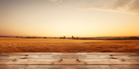 Obraz premium Hanging wooden planks framed against a golden-hued horizon, suggesting a serene rural setting