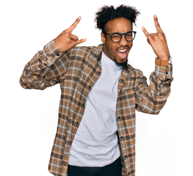 Young african american man with beard wearing casual clothes and glasses shouting with crazy expression doing rock symbol with hands up. music star. heavy music concept.