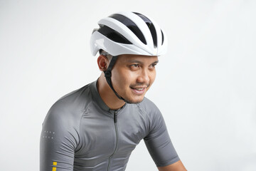 Portrait of a young Asian man using a helmet bike.  Isolated on a white background. Travel and...