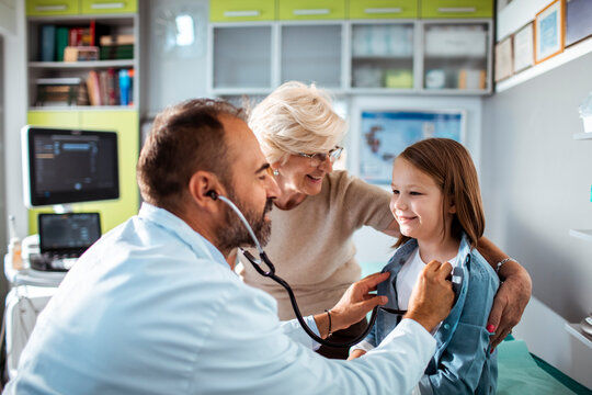 Young Girl at Doctors Appointment with Grandmother